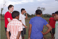 Physiologist, Gareth Sandford, and School Sports Coordinator, Rohan Kandoi (both back left) debrief some of the student athletes new to Khel Vikas school sports.